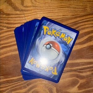 Pack of 50 RANDOM Pokemon Cards (Surging Sparks, temporal forces)